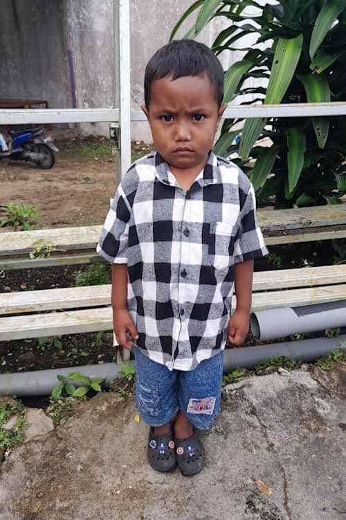An unsponsored boy named Tian from Indonesia who has waited 501 days for a sponsor.