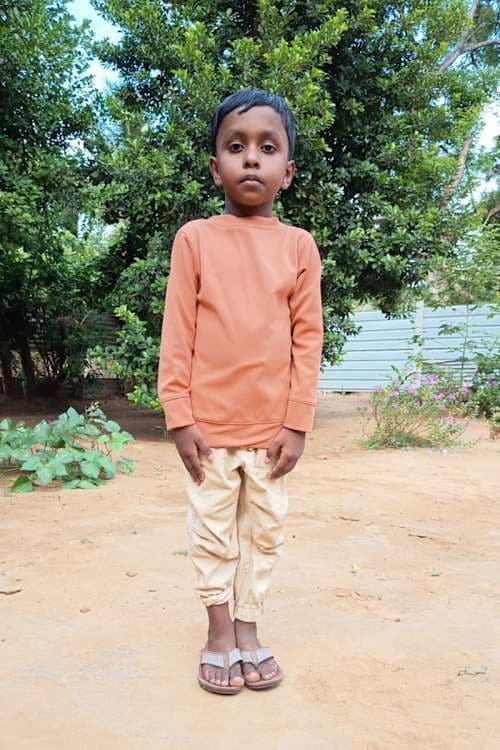 An unsponsored boy named Kabish from Sri Lanka who has waited 221 days for a sponsor.