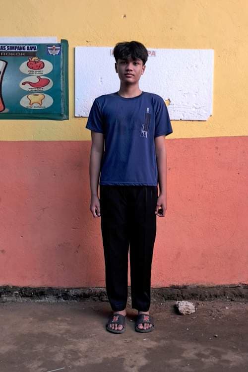 An unsponsored boy named Yonathan from Indonesia who has waited 507 days for a sponsor.