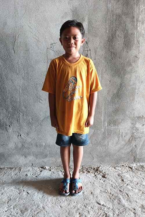 An unsponsored boy named Messy from Indonesia who has waited 507 days for a sponsor.