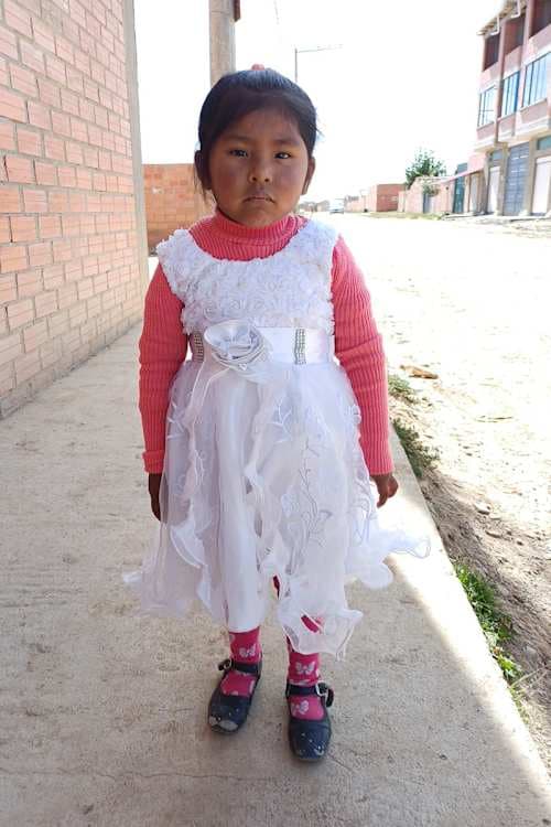 An unsponsored girl named Mishel from Bolivia who has waited 590 days for a sponsor.