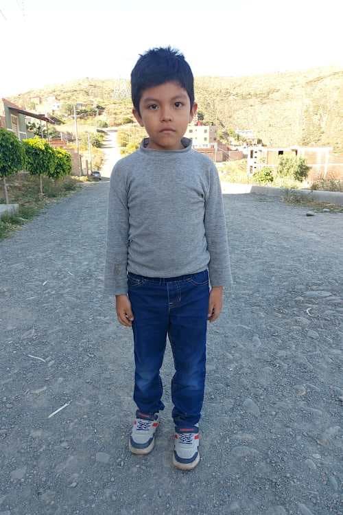 An unsponsored boy named Dorian from Bolivia who has waited 597 days for a sponsor.