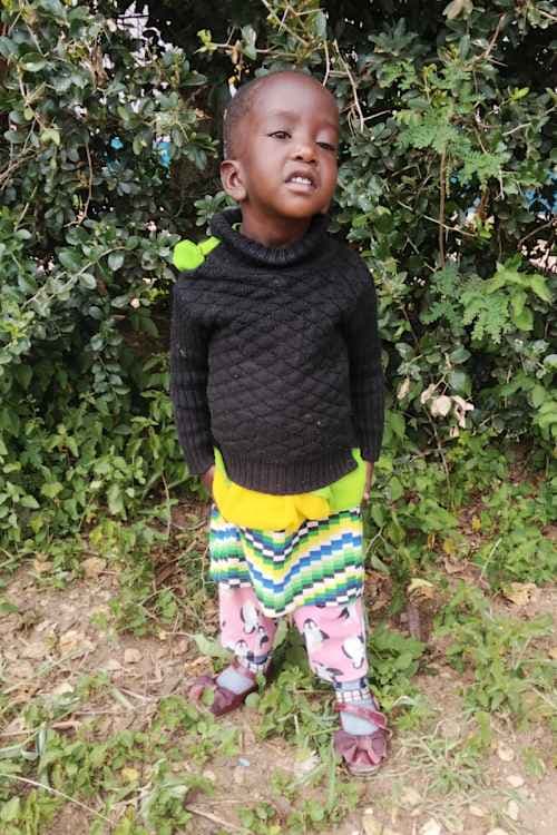 An unsponsored girl named Mumbi from Kenya who lives in an AIDS-affected area and has waited 650 days for a sponsor.