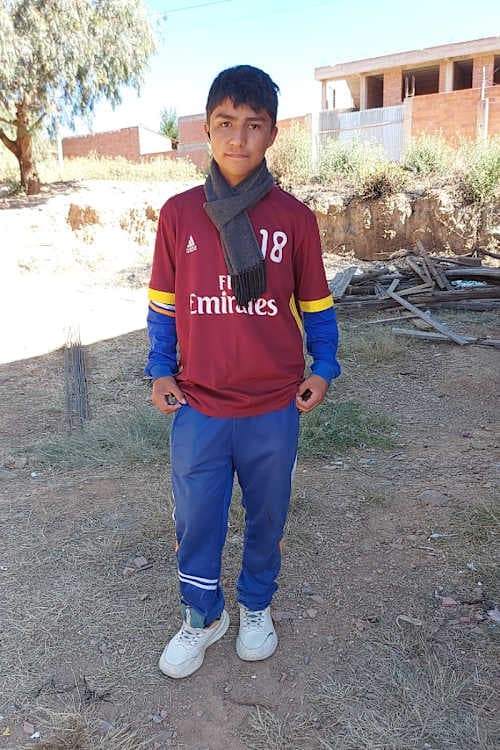 An unsponsored boy named Nicolas from Bolivia who has waited 465 days for a sponsor.