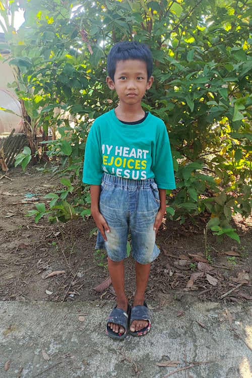 An unsponsored boy named Satria from Indonesia who has waited 553 days for a sponsor.
