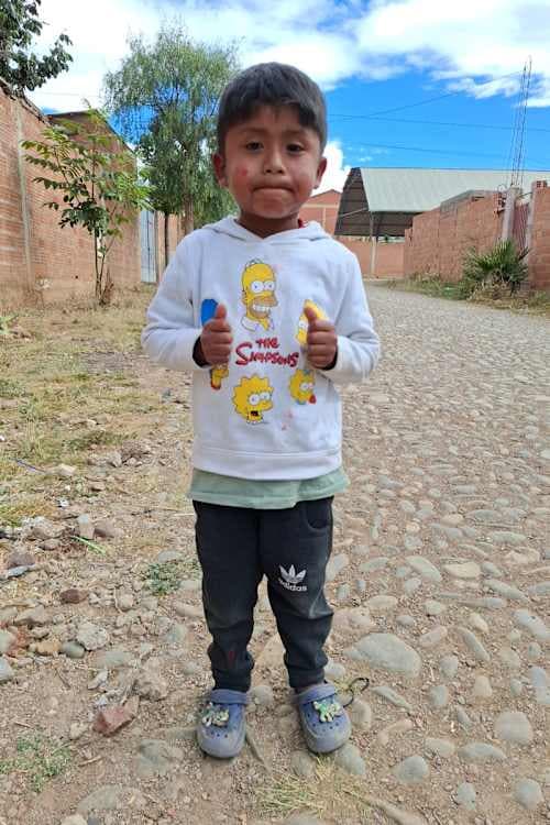 An unsponsored boy named Jhon Kevin from Bolivia who has waited 609 days for a sponsor.