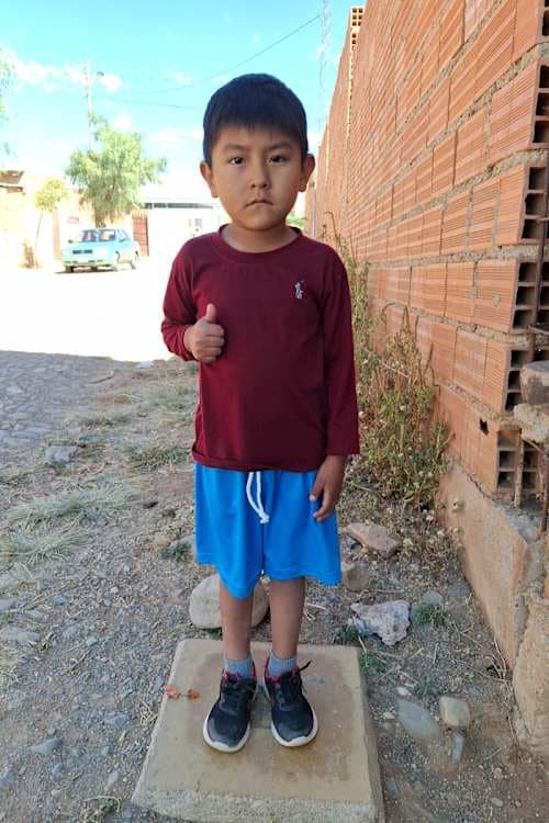 An unsponsored boy named Ian from Bolivia who has waited 643 days for a sponsor.