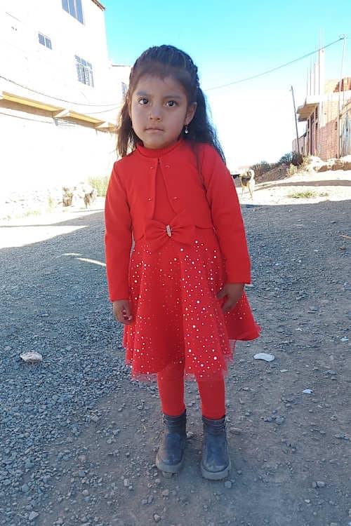 An unsponsored girl named Ariane from Bolivia who has waited 504 days for a sponsor.