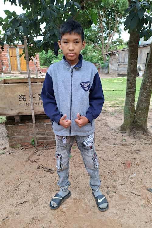 An unsponsored boy named Jhunior from Bolivia who has waited 588 days for a sponsor.
