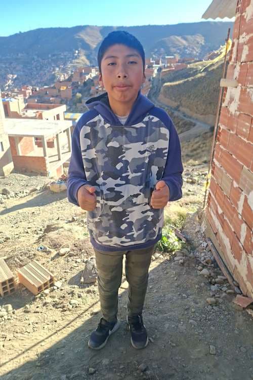 An unsponsored boy named Iker from Bolivia who has waited 369 days for a sponsor.