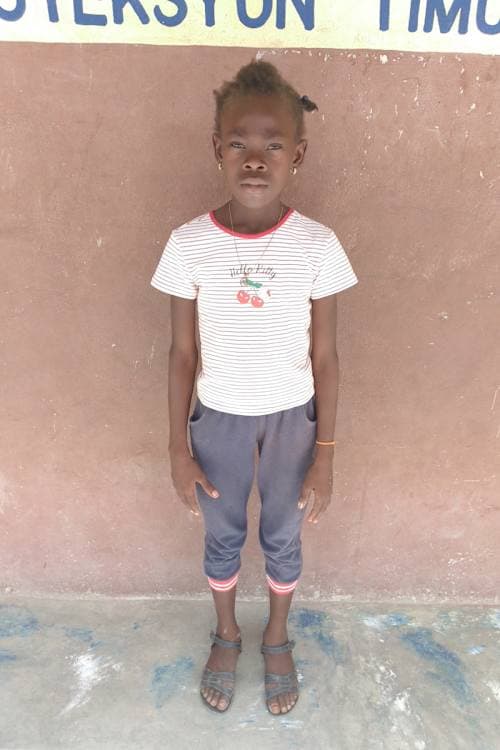 An unsponsored girl named Ester from Haiti who is vulnerable to exploitation and has waited 513 days for a sponsor.