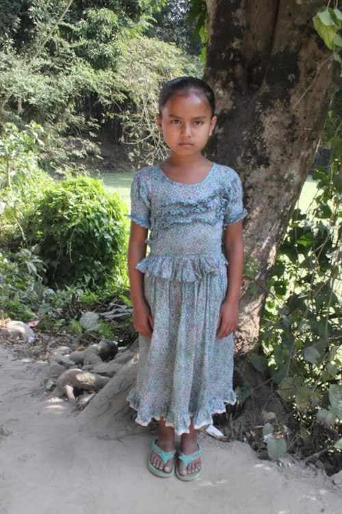 An unsponsored girl named Puspo from Bangladesh who is vulnerable to exploitation and has waited 508 days for a sponsor.