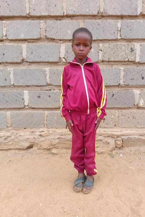 An unsponsored boy named Malik from Kenya who lives in an AIDS-affected area and has waited 616 days for a sponsor.