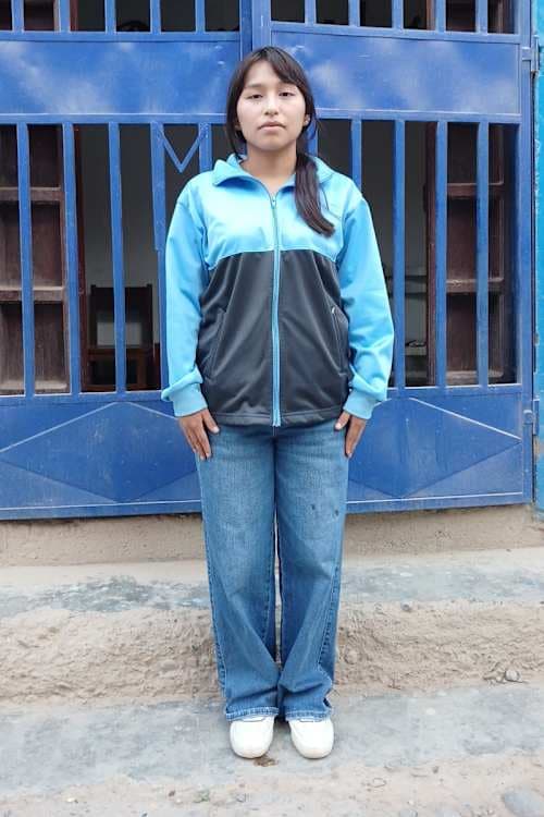 An unsponsored girl named Gimena from Peru who has waited 407 days for a sponsor.