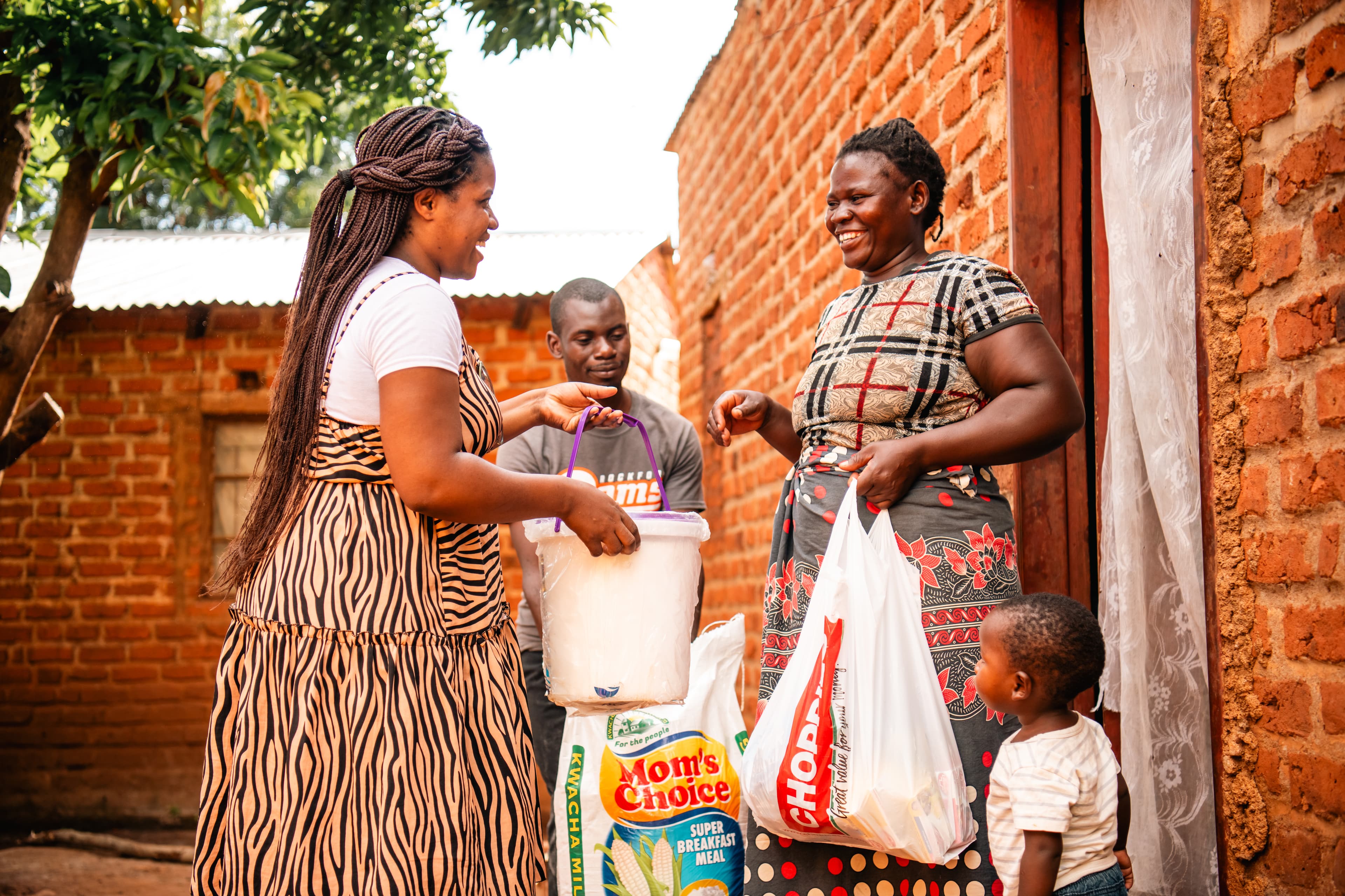 A Center staff member delivers food to a family in need.