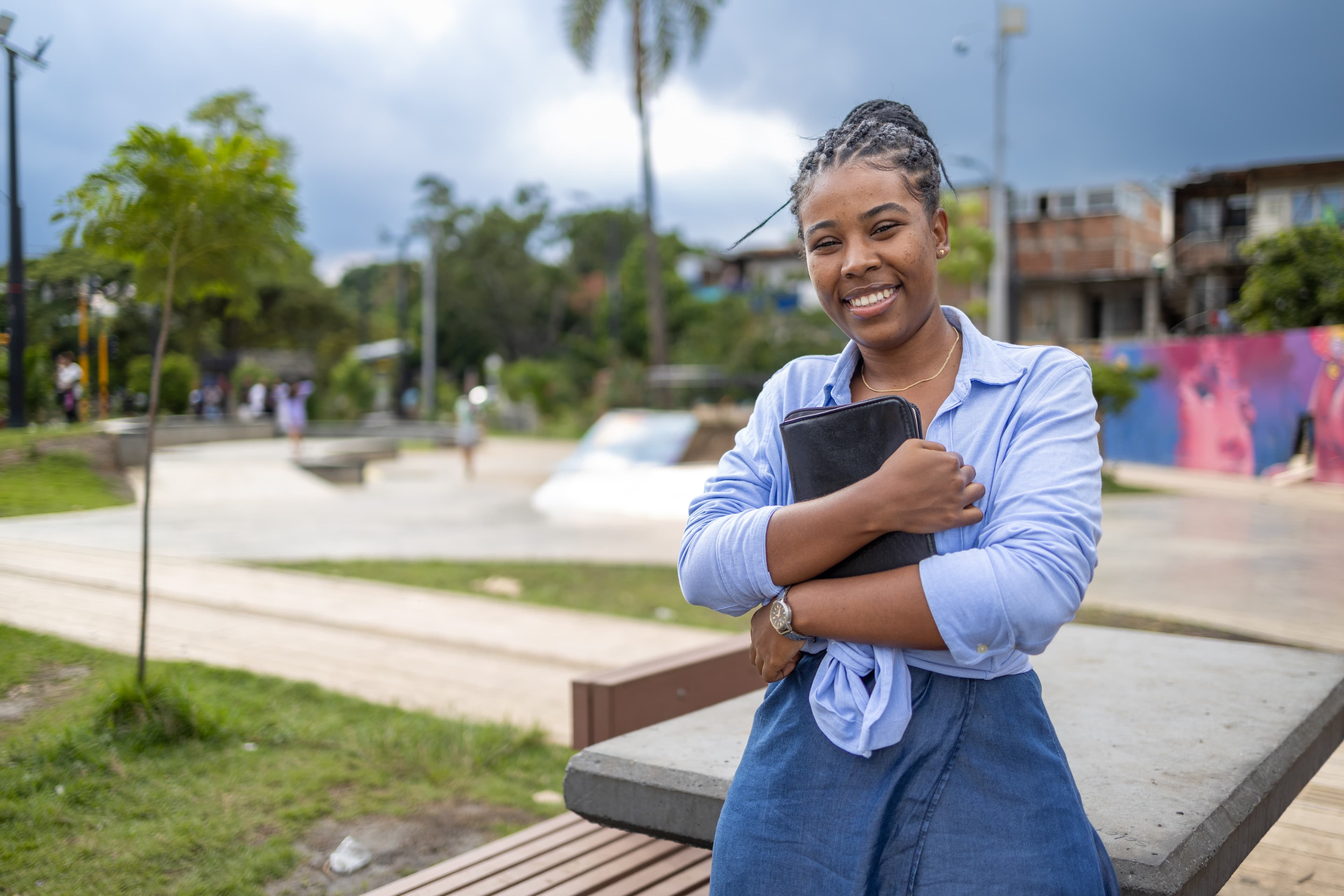 Leidy stands and holds Bible