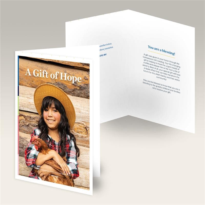 Digital artwork of both a closed card that says, "A Gift of Hope" with an image of a girl holding a chicken, and an opened card with blue text.