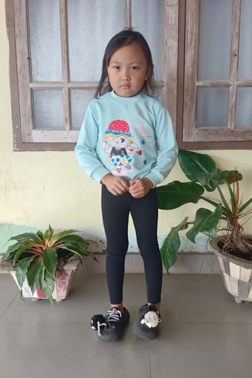 An unsponsored girl named Shine from Indonesia who has waited 515 days for a sponsor.