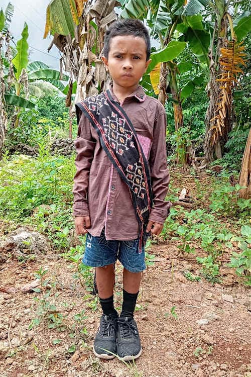 An unsponsored boy named Rendy from Indonesia who has waited 443 days for a sponsor.