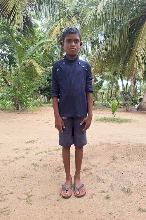 An unsponsored boy named Radhurshan from Sri Lanka who has waited 461 days for a sponsor.