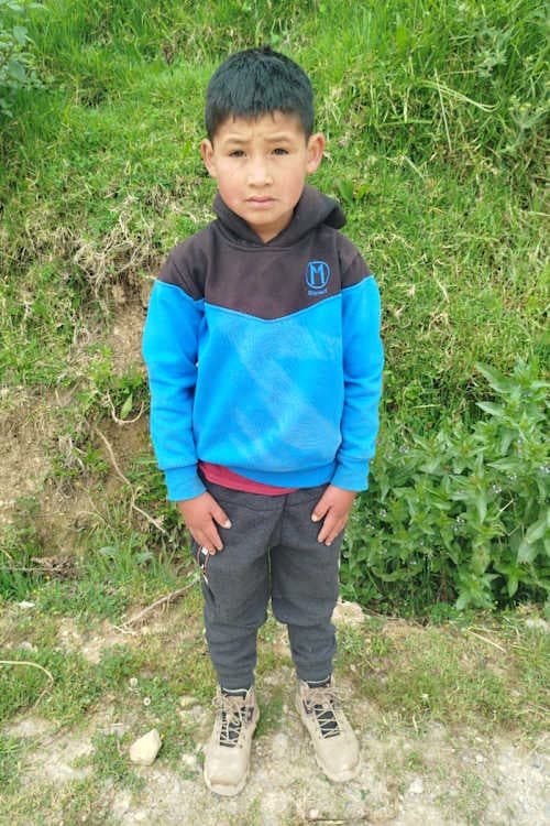 An unsponsored boy named Esnaider from Peru who has waited 464 days for a sponsor.
