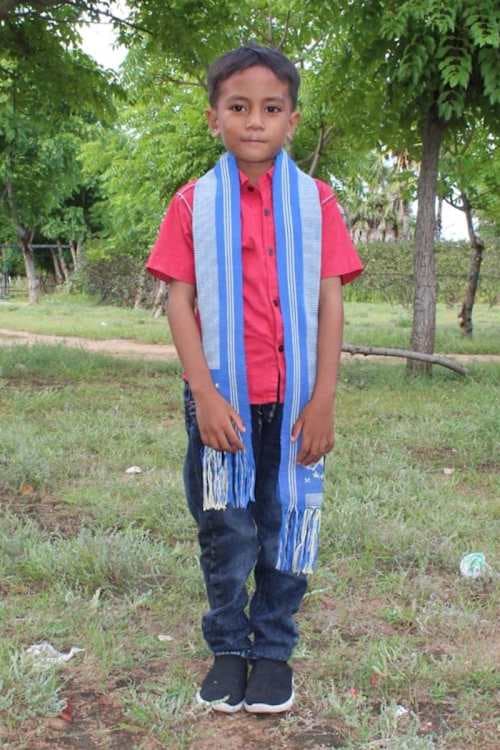 An unsponsored boy named Estana from Indonesia who has waited 437 days for a sponsor.