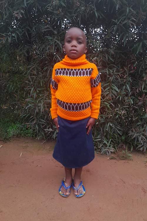 An unsponsored girl named Emelyne from Rwanda who lives in an AIDS-affected area, is vulnerable to exploitation and has waited 408 days for a sponsor.