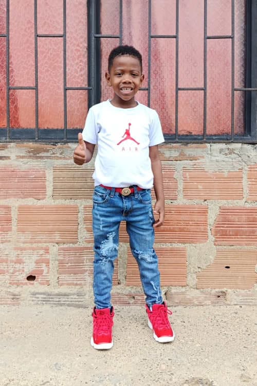 An unsponsored boy named Jaikol from Colombia who has waited 412 days for a sponsor.