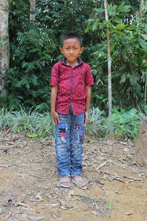 An unsponsored boy named Cio from Indonesia who has waited 442 days for a sponsor.