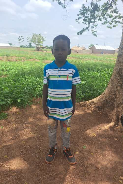 An unsponsored boy named Nbebalan from Ghana who lives in an AIDS-affected area and has waited 428 days for a sponsor.