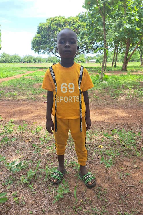 An unsponsored boy named Bikamba from Ghana who lives in an AIDS-affected area and has waited 437 days for a sponsor.