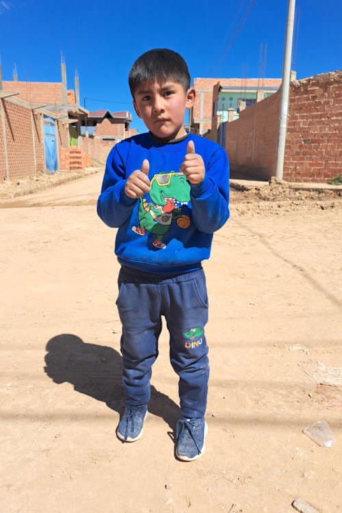 An unsponsored boy named Franco from Bolivia who has waited 496 days for a sponsor.