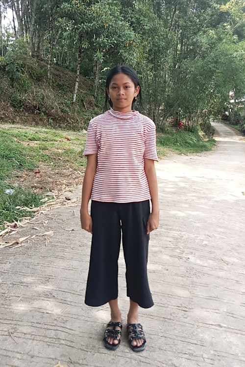 An unsponsored girl named Kasih from Indonesia who has waited 609 days for a sponsor.