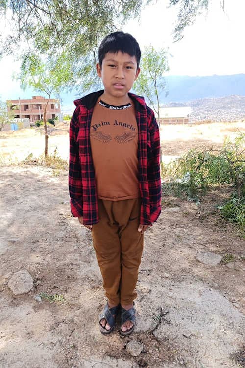An unsponsored boy named Juan Felix from Bolivia who has waited 555 days for a sponsor.