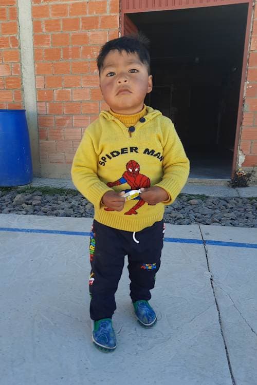 An unsponsored boy named Lin Beymar from Bolivia who has waited 598 days for a sponsor.