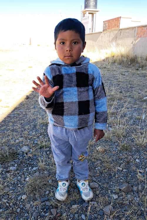 An unsponsored boy named Yamil from Bolivia who has waited 600 days for a sponsor.