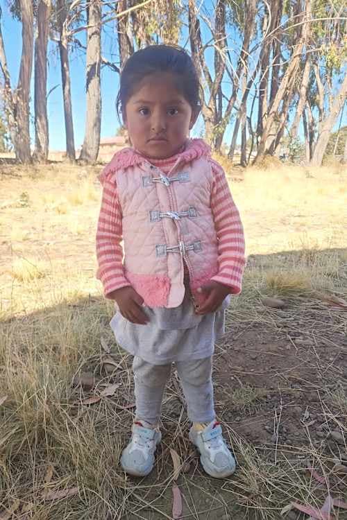 An unsponsored girl named Nelia from Bolivia who has waited 598 days for a sponsor.