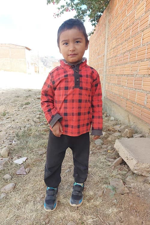 An unsponsored boy named Jhojan from Bolivia who has waited 579 days for a sponsor.