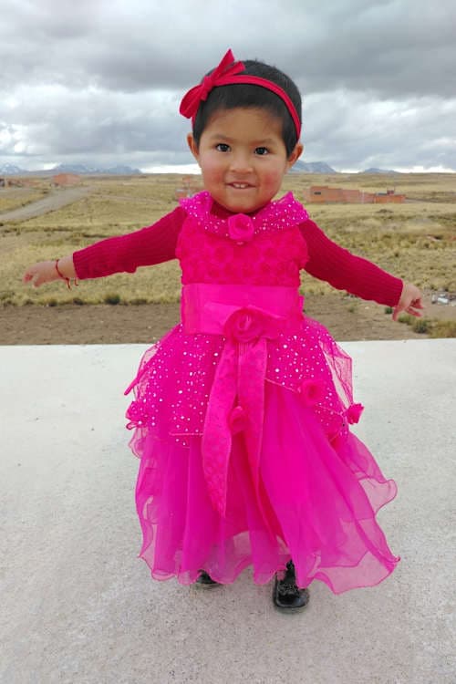 An unsponsored girl named Aide from Bolivia who has waited 579 days for a sponsor.