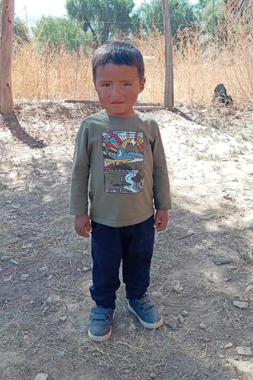 An unsponsored boy named Liam Axel from Bolivia who has waited 584 days for a sponsor.