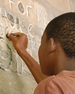 Godfry writing on a chalk board