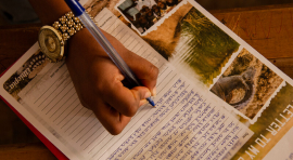 a person writes a letter to their sponsored child