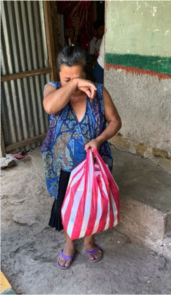 Ivis' granmother receiving groceries