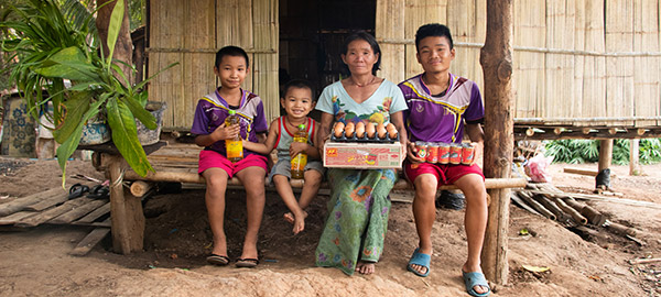 A family sits holding food