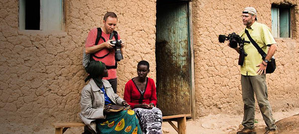 Compassion photographers capturing pictures of two women sitting on a bench