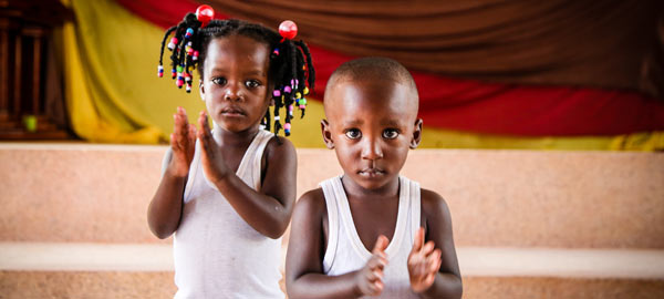 A young boy and girl clapping